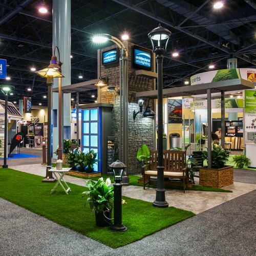 AAL lighting's trade show booth with lights and chairs 