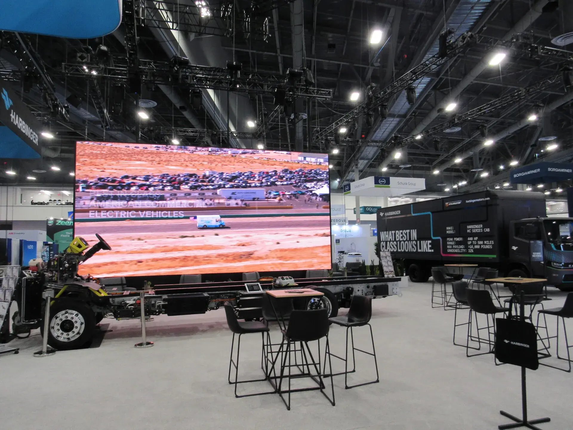 Harbinger LED video wall with electric vehicle content and attendee engagement seating