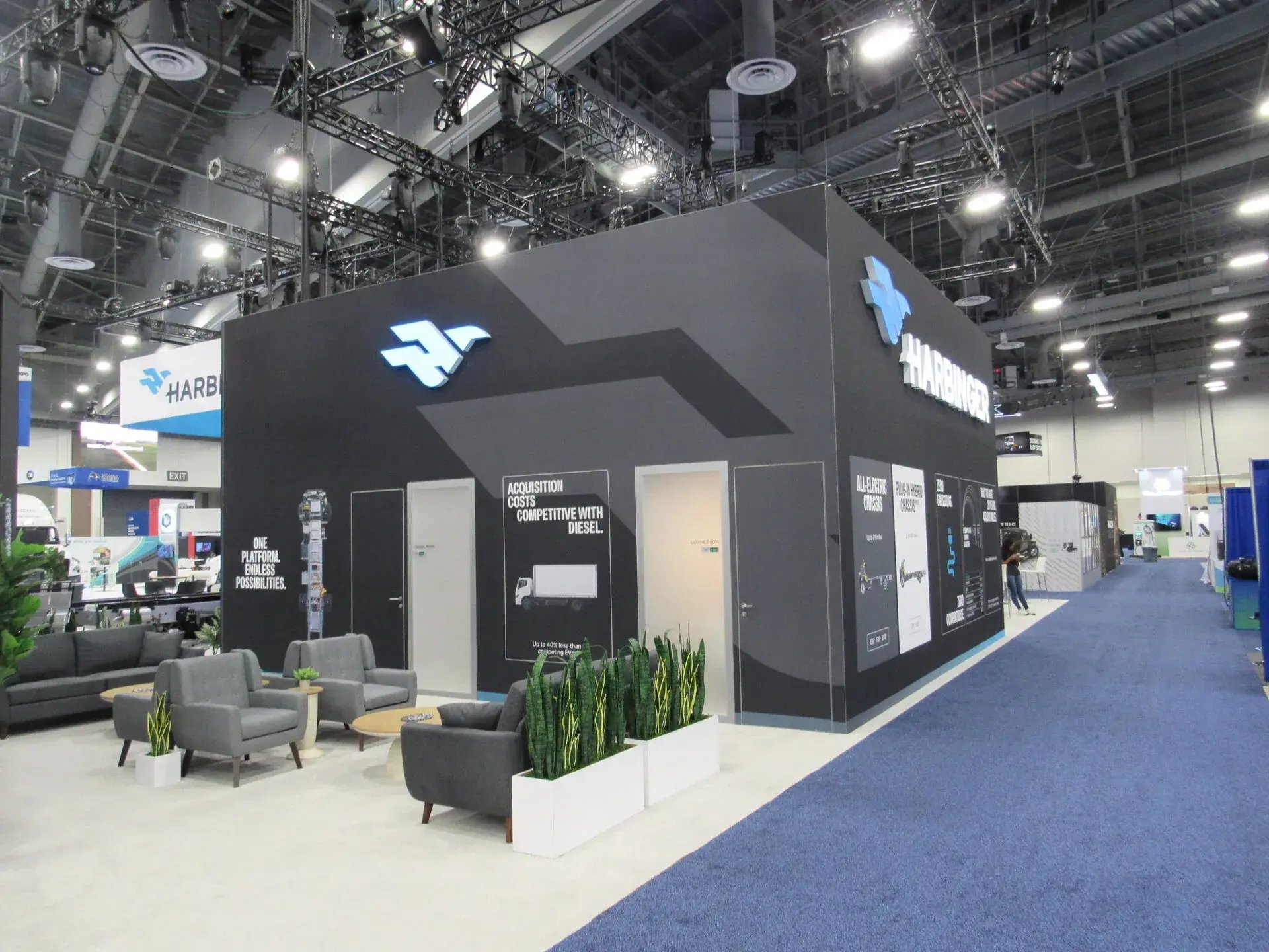 Enclosed private meeting rooms and lounge seating in the Harbinger exhibit