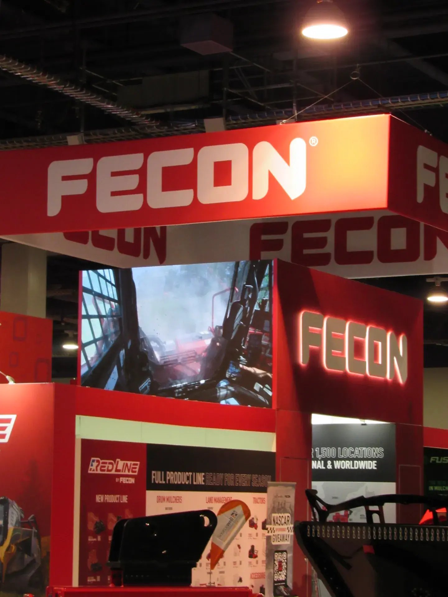 Large-format LED video wall showing Fecon equipment in real-world applications