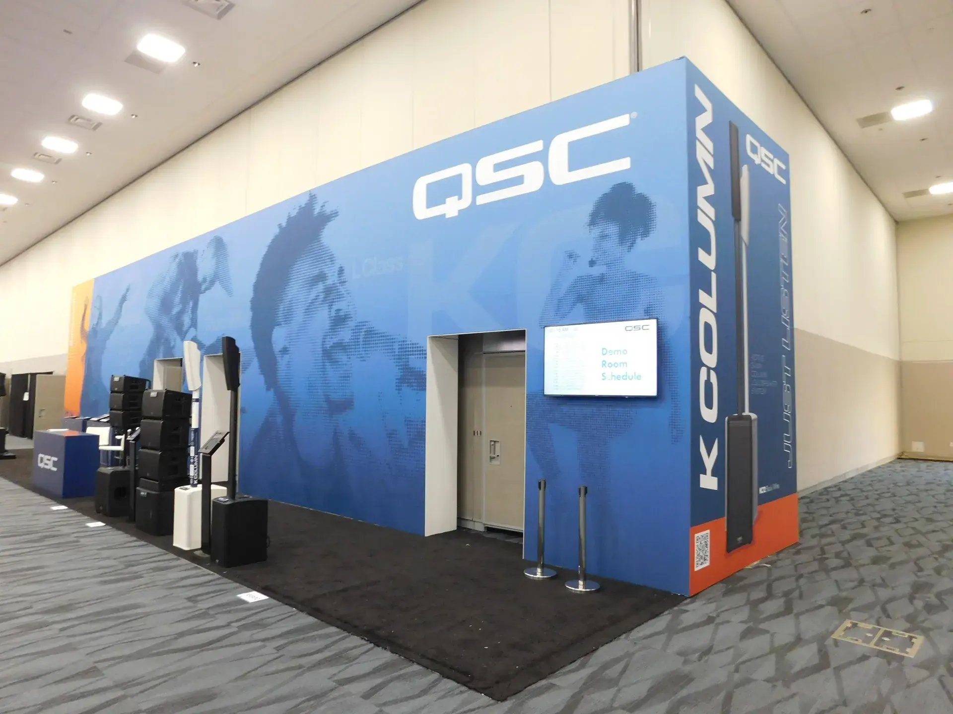 Convention center corridor transformed with full-height branded graphics around the meeting room entrance