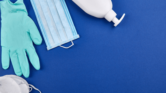 An assortment of PPE devices on a blue background 