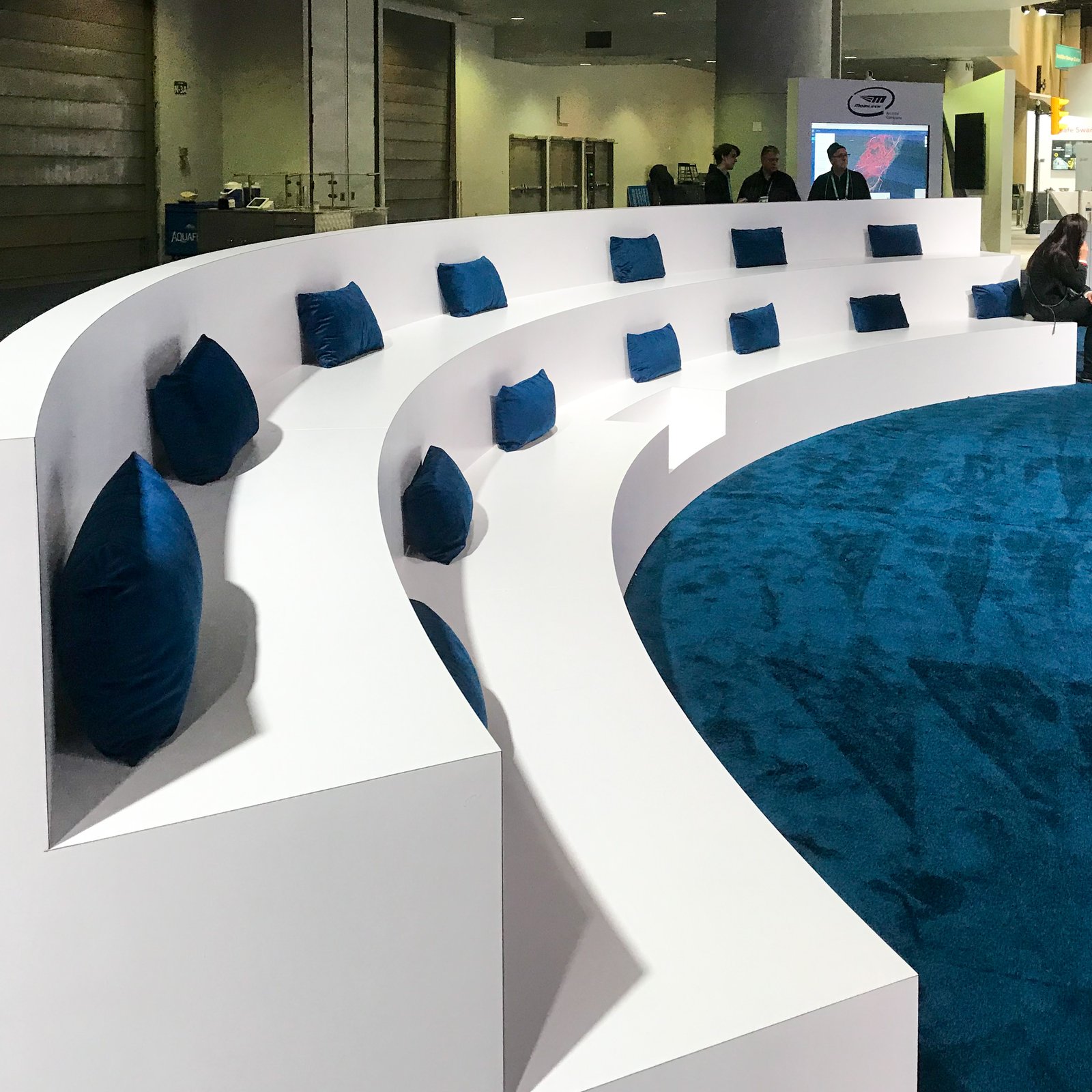 white sitting area with blue cushions to match blue floor at ces 2020 mobileye