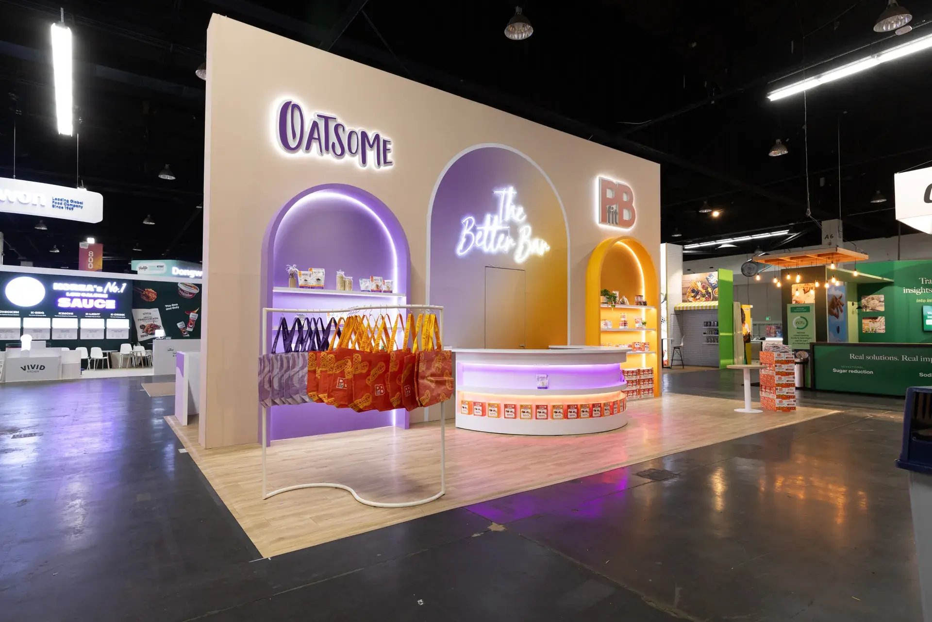 BetterBody Foods 20x30 rental exhibit front elevation with PBfit and Oatsome brand arches and The Better Bar