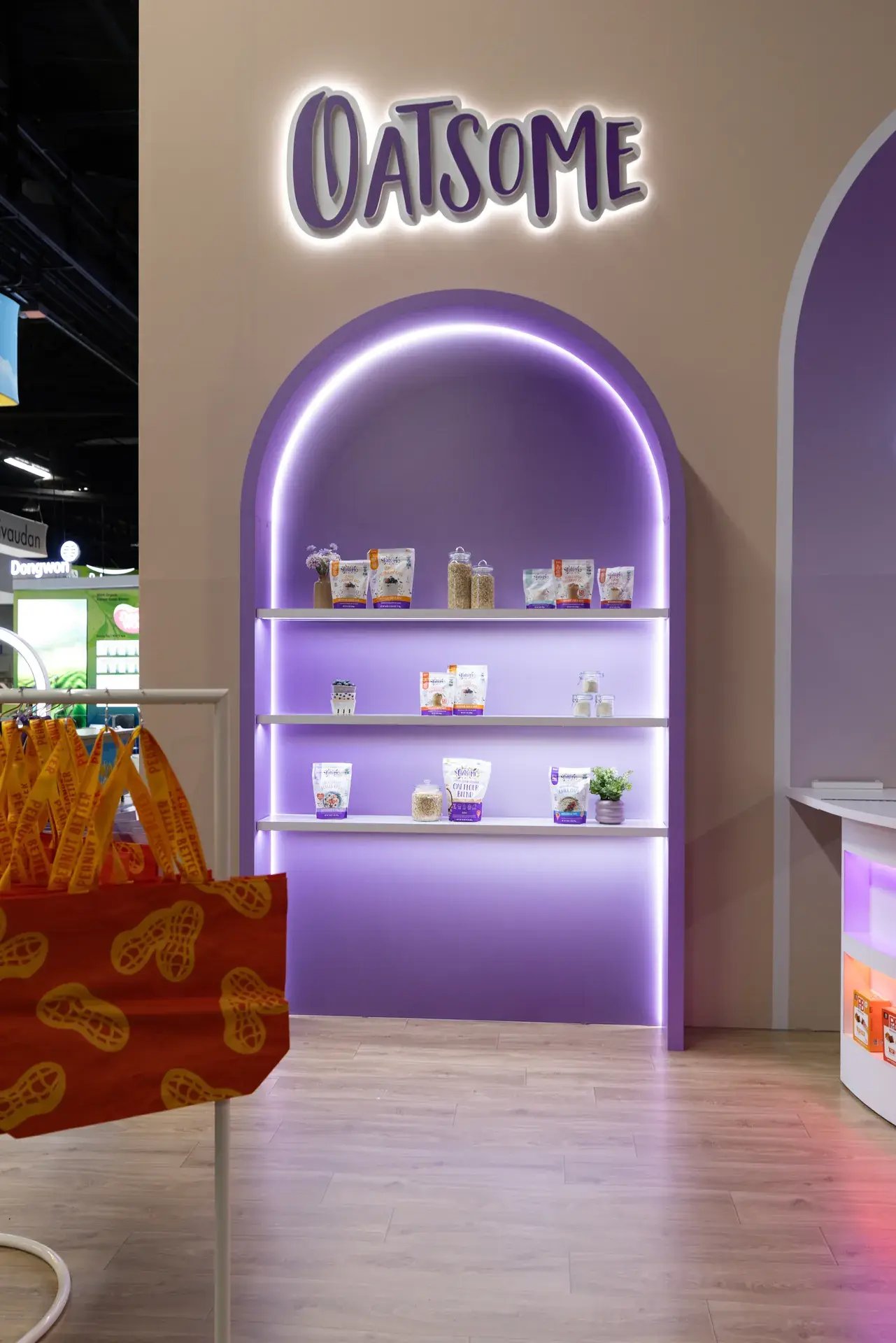 Illuminated Oatsome product alcove in the BetterBody Foods exhibit