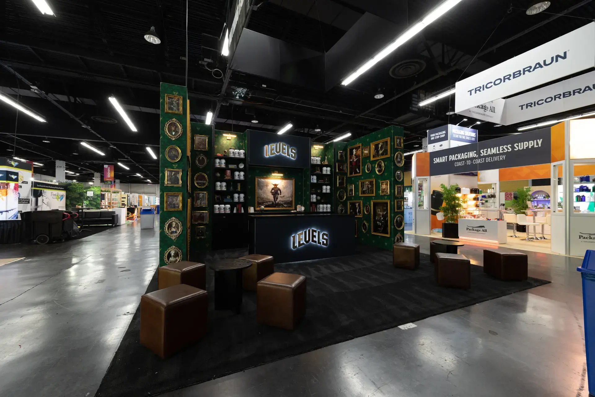 Angled aisle view of the LEVELS island exhibit on the Natural Products Expo West show floor