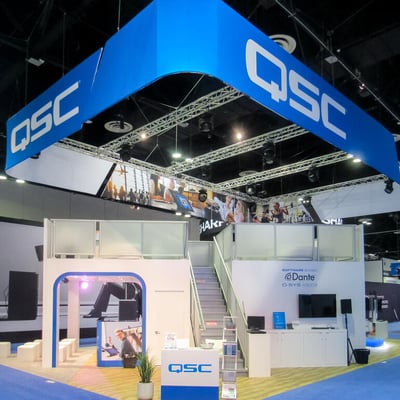 Double decker QSC trade show booth at Infocomm